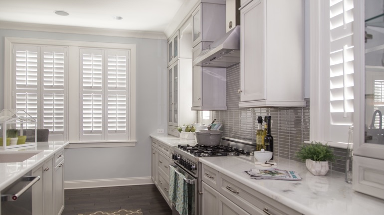 Polywood shutters in St. George kitchen with white cabinets.